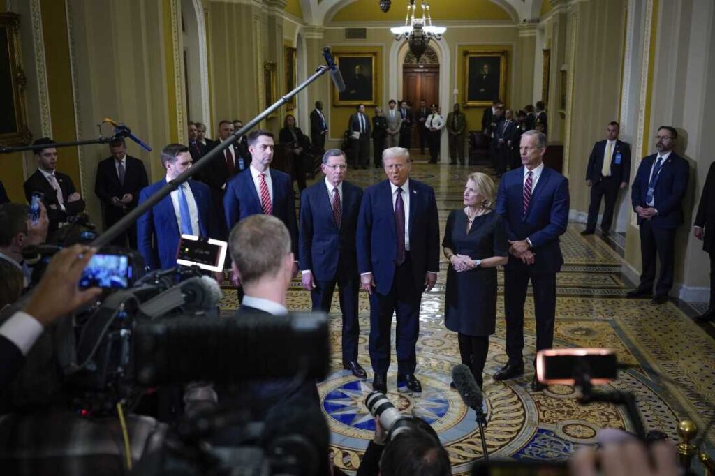 President-elect Donald Trump talks to reporters after a meeting with Republican leadership at the Capitol on Wednesday, Jan. 8, 2025, in Washington. From left, Vice President-elect Sen. JD Vance, R-Ohio, Sen. Tom Cotton, R-Ark., Sen. John Barrasso, R-Wyo., Trump, Sen. Shelley Moore Capito, R-W.Va., and Senate Majority Leader John Thune of S.D.